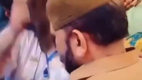 Islamic doctor treats patients with his slipper.
