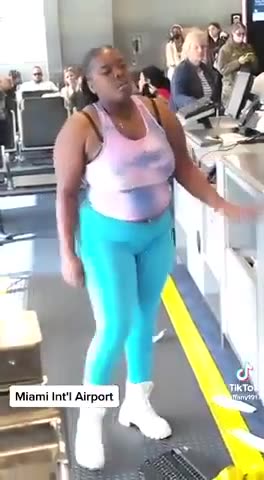 Negress loses her kids at airport and chimps out