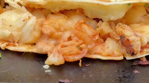 Taco filled with lobster and cheese recipe