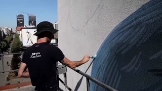 Giant murals bring small Kosovo town to life