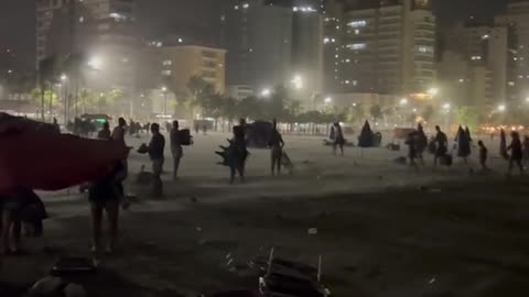 Sudden Surge of Wind Takes Beachgoers by Surprise