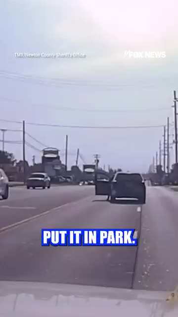 A heroic cop jumped into action after an elderly man had a heart attack behind the wheel