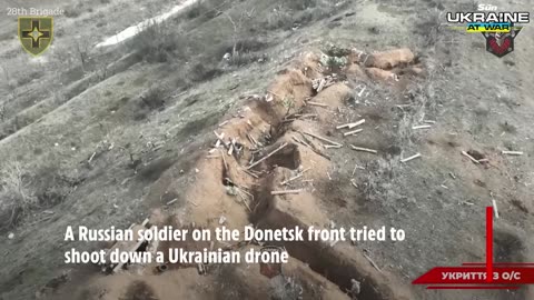 Heart-stopping moment Russian soldier opens fire on drone as explosion rocks trench