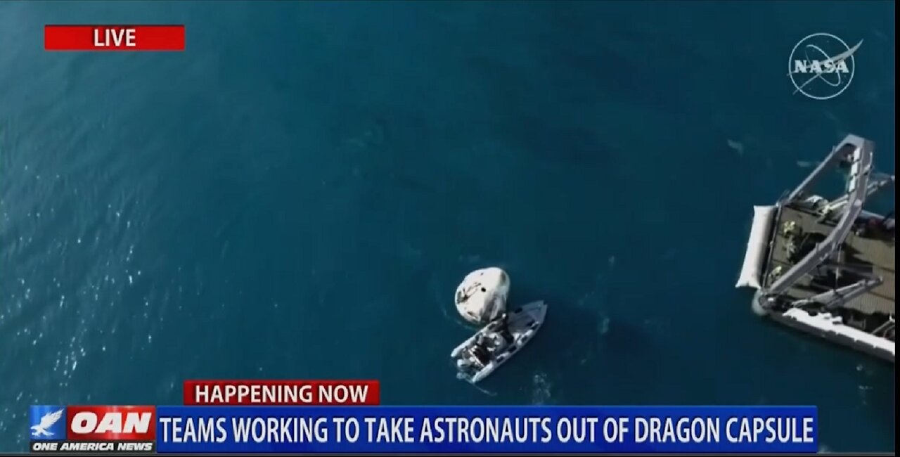 TEAMS WORKING TO TAKE ASTRONAUTS OUT OF DRAGON CAPSULE