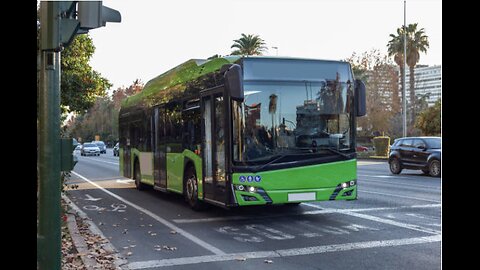 A green bus in Córdoba, Spain - stock photo
