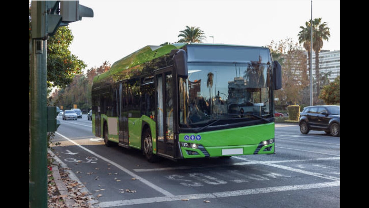 A green bus in Córdoba, Spain - stock photo