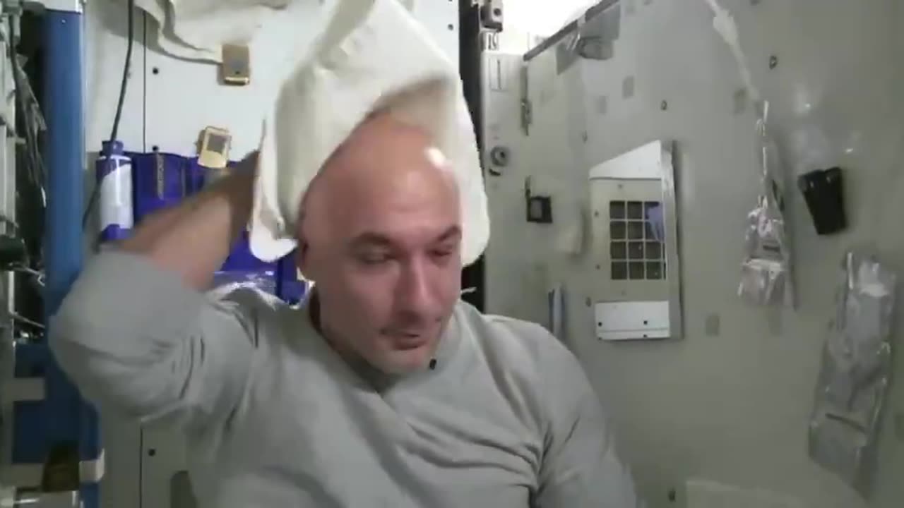astronaut washes his hair in space