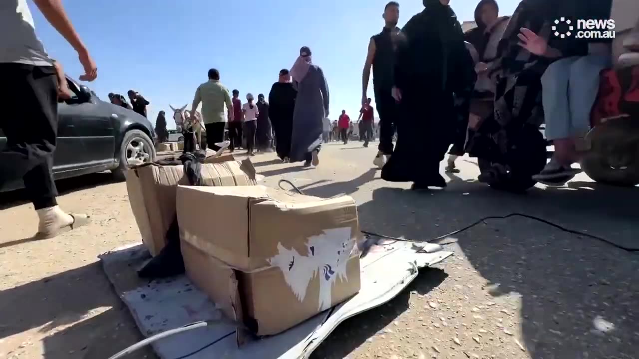 Palestinians rush to US, Israel-backed aid amid biometrics concern - news.com.au