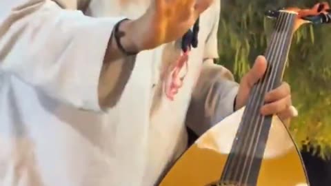 lslamic schoIar destroys musical instruments because Allah does not like music.