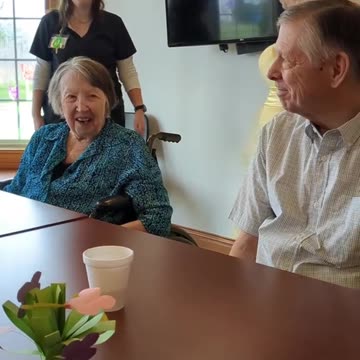 Our memory care residents trying on dresses for our senior