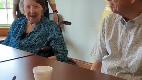 Our memory care residents trying on dresses for our senior