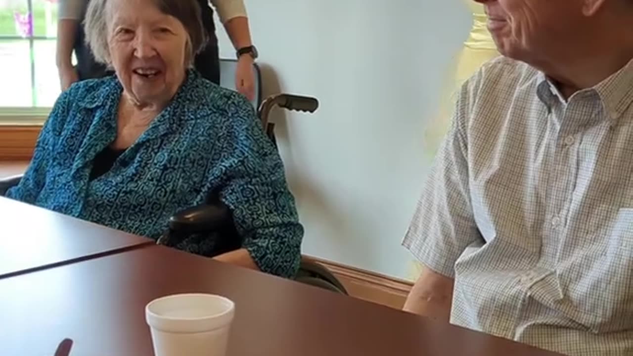 Our memory care residents trying on dresses for our senior