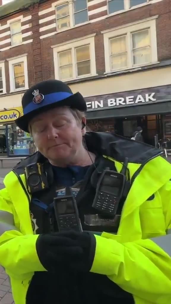 A man takes some photos and is stopped and questioned