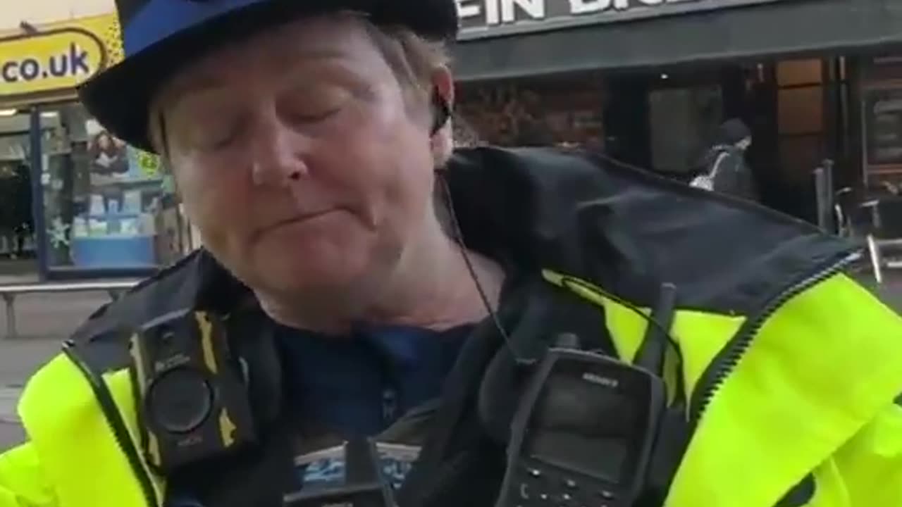 A man takes some photos and is stopped and questioned