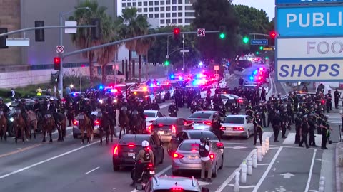 Police scale up presence as curfew kicks in for downtown LA