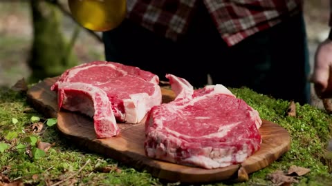 Cooked Perfect Tomahawk Steaks Over an Open Fire 1