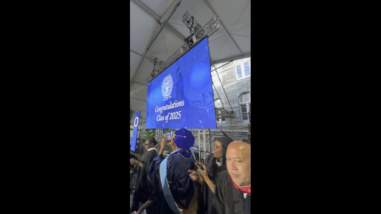 Gemach DAO on stage at Georgetown University Commencement