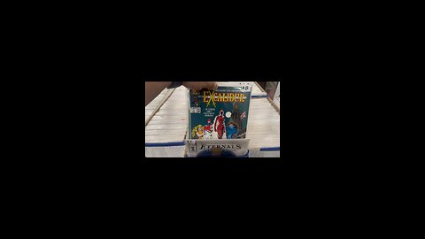 Looking through long boxes of Comic Books.