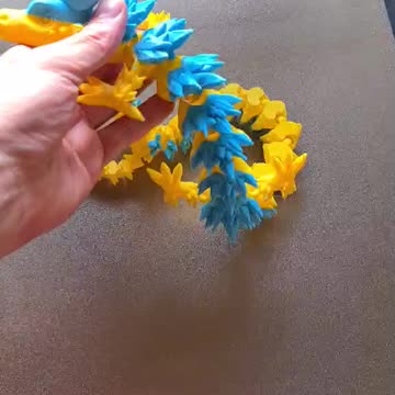 Blue and Yellow Dragon coming off the build plate