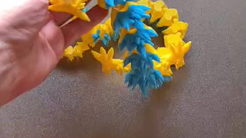 Blue and Yellow Dragon coming off the build plate