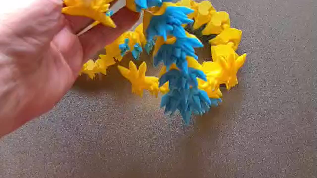 Blue and Yellow Dragon coming off the build plate