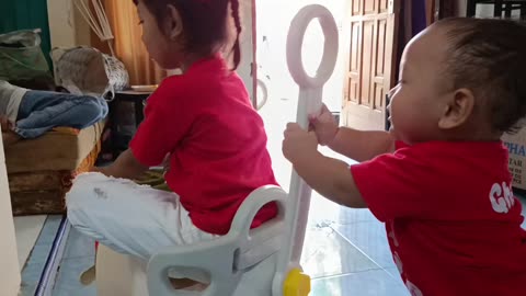 Two Siblings Playing Together at Home – Sweet Childhood Moments"