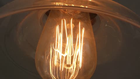 Close up on filiments inside restaurant lighting