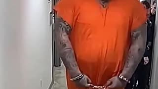 This prisoner is so huge he can't fit into the cell.