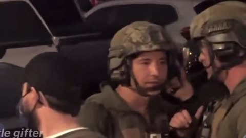 FBI agents have strobe lights shined in their faces as people shout “Get the f*ck out of here”