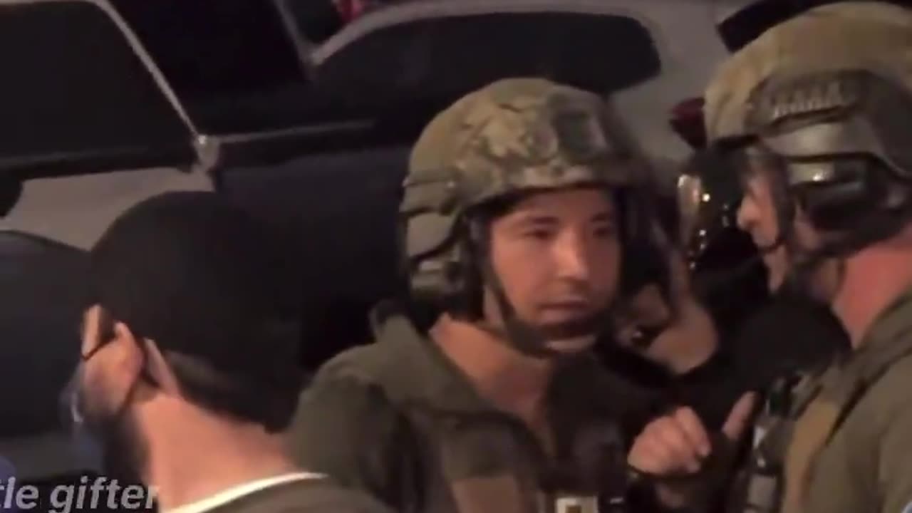 FBI agents have strobe lights shined in their faces as people shout “Get the f*ck out of here”
