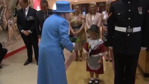 Little girl accidentally hit in the face by soldier after meeting the Queen