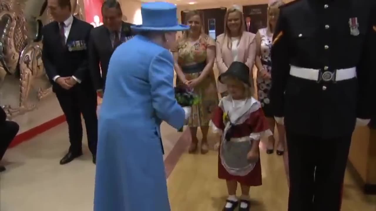 Little girl accidentally hit in the face by soldier after meeting the Queen