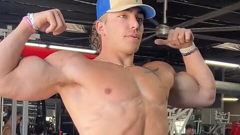 Young man flexing big biceps