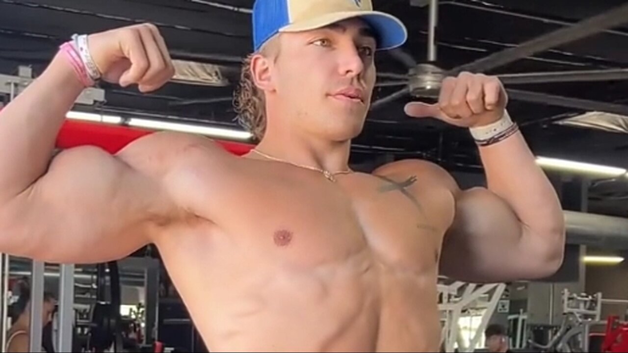 Young man flexing big biceps