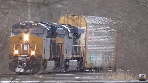 The Majestic Power of Freight Trains in Snowy Crossings