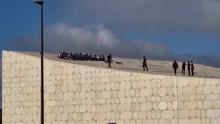 Police officers climbed onto the roof of the National Library in Jerusalem