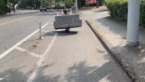 Couple Use Electric Scooter To Transport Couch
