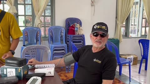 Joe getting his blood pressure taken outside of Mandalay