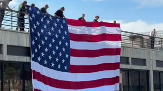 Beautiful gesture by UVU, unfurling an American flag at the spot of Kirk’s assassination