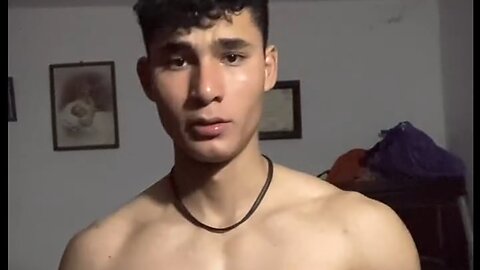 18 years old teen boy flexing muscles