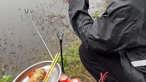Look how this man catches a fish and eats it right away