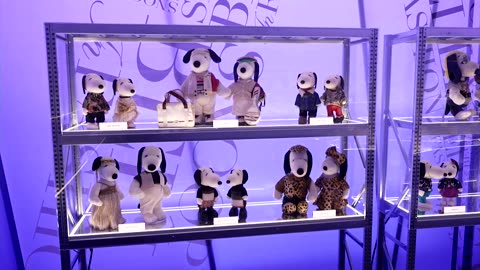 Cartoon dog Snoopy dresses up in designer gear for 75th birthday