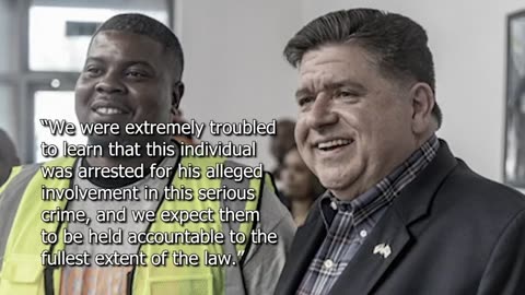 JB Pritzker poses for a photo with a man that’s apart of Illinois “Peacekeepers”