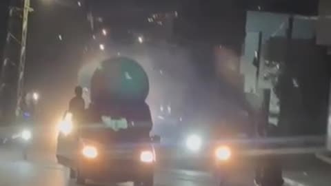 Cheerful Palestinians take boosters of Iranian missiles