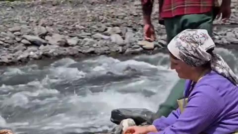 Traditional method of making jam in Azerbaijan with fresh strawberries washed in a river