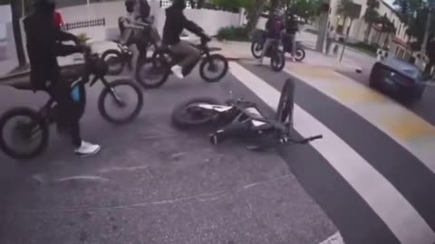 MUSTANG RUNS OVER BIKE – BIKER NARROWLY ESCAPES