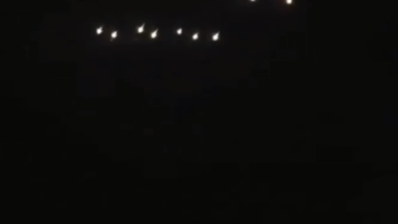 A fleet of luminous objects UFOs in formation is captured from a vehicle 🛸🛸🛸