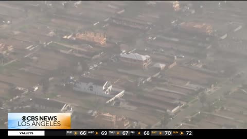 Aerial View of Palisades Fire burn scar and a look at the rebuilding 'progress'
