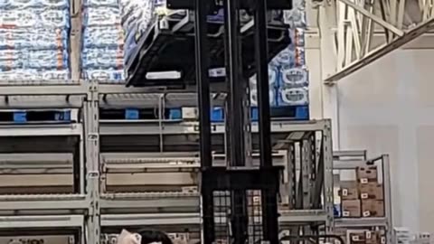 Warehouse Mishap: Water Bottle Avalanche! 💧😬