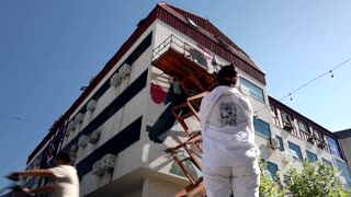 Artists from across the globe have gathered in a small town in Kosovo, transforming its appearance